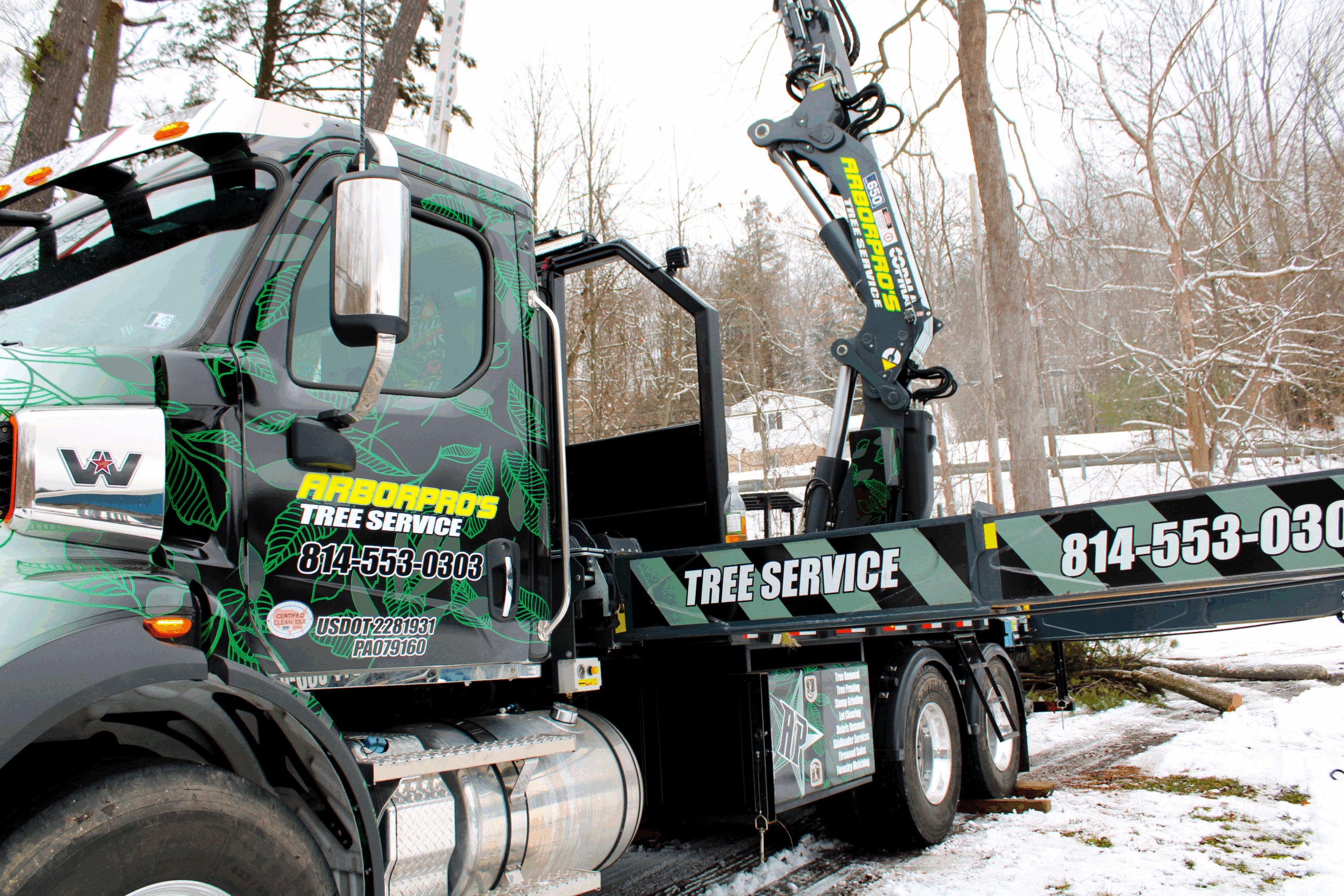 Close-up of Arbor Pro's knuckle boom crane truck and grapple saw